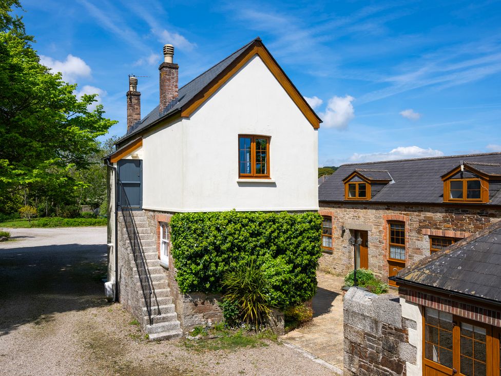 A house with stairs and windows at The Hayloft in Budock Water near Falmouth