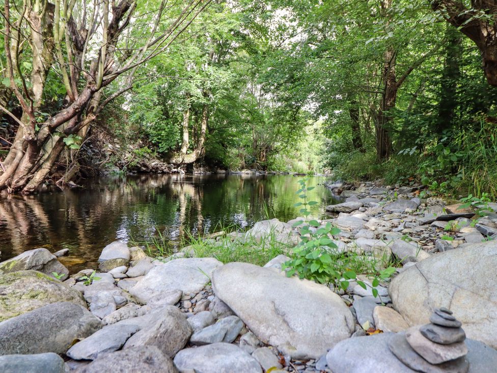 A river with trees and rocks in Glyn Ceiriog, near Chirk Dolhiryd