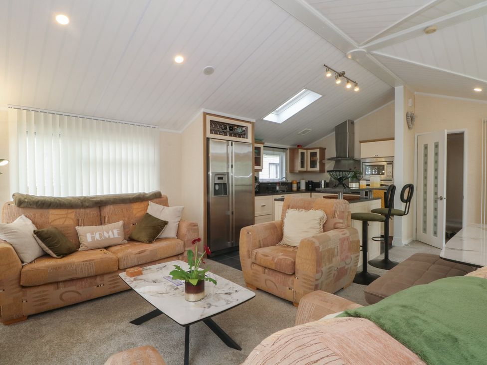 A living room with a sofa and coffee table at Labernum in Lytham St. Annes