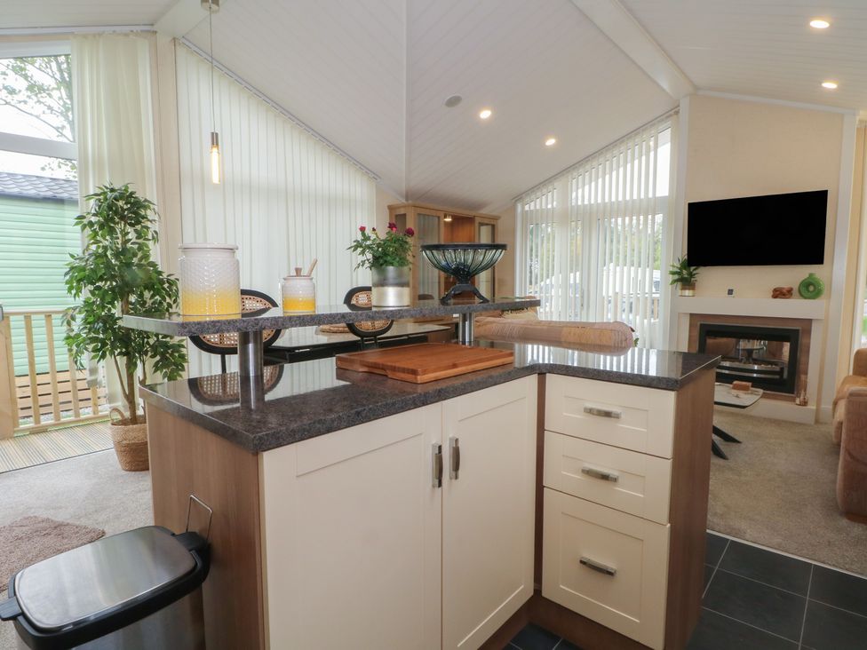 A kitchen with a countertop and storage at Labernum in Lytham St. Annes