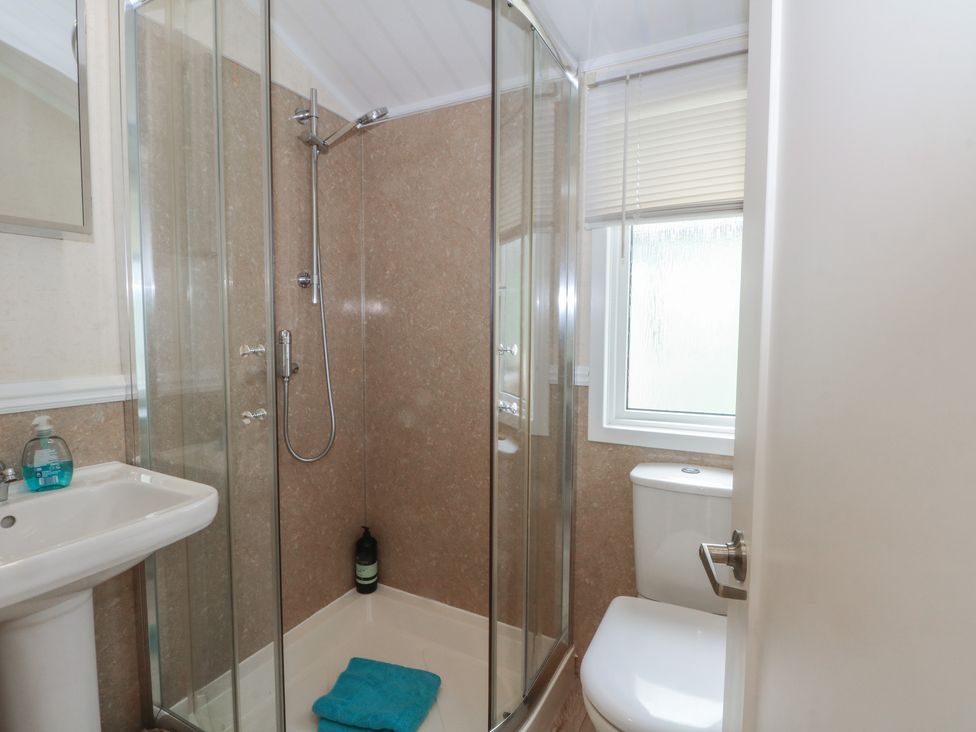 A bathroom with a shower and toilet at Labernum in Lytham St. Annes