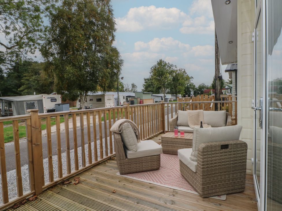 A deck with seating and a table at Labernum in Lytham St. Annes