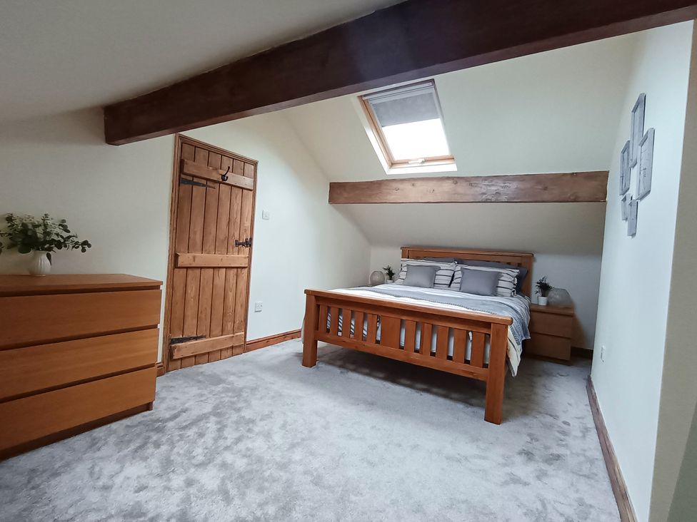 A bedroom with a bed and dresser at 14 Lindon Street