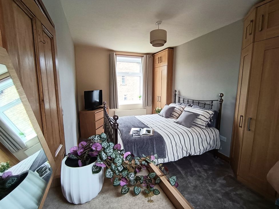 A bedroom with a bed and television at 14 Lindon Street