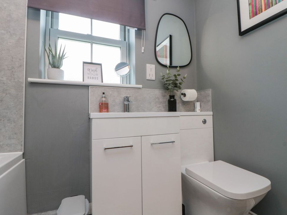 A bathroom with a sink and toilet at Rosie's Retreat in Filey