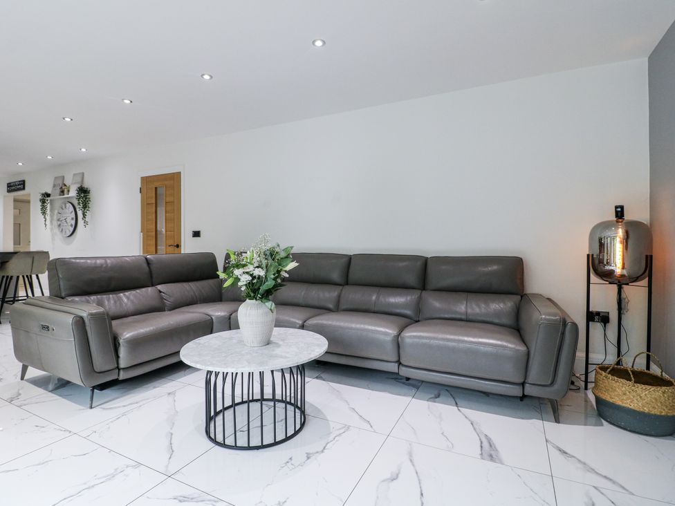 A living room with a sofa and coffee table at Rockcliffe Grange in Mansfield