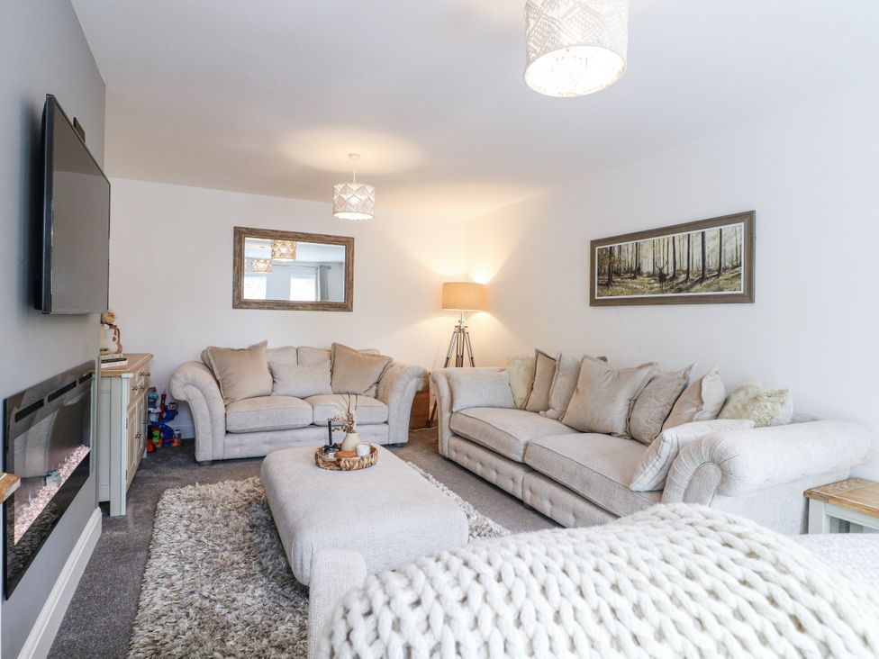 A living room with a sofa and coffee table at Rockcliffe Grange in Mansfield