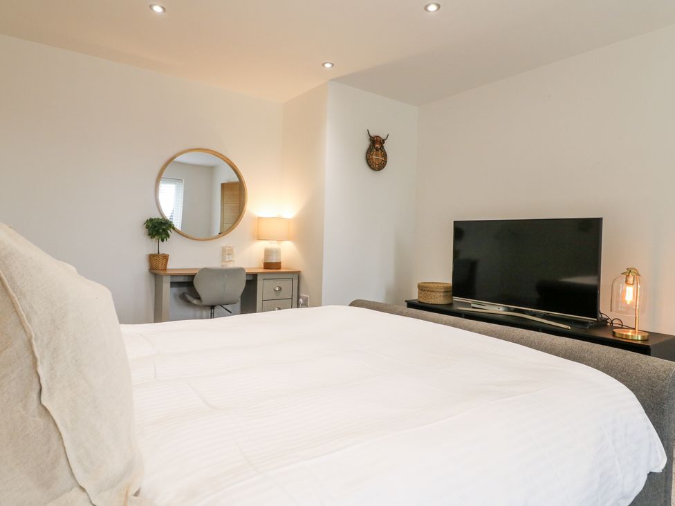 A bedroom with a bed and television at Rockcliffe Grange in Mansfield