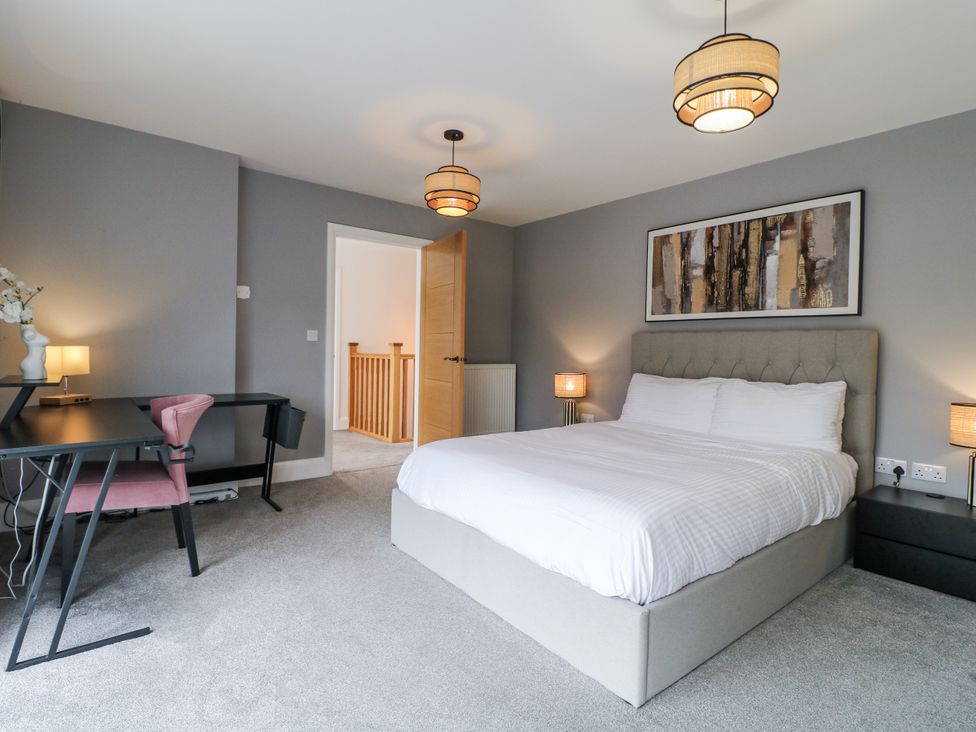 A bedroom with a bed and desk at Rockcliffe Grange in Mansfield