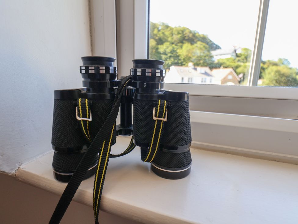 Binoculars on a windowsill at Woodbine Cottage in Whitby