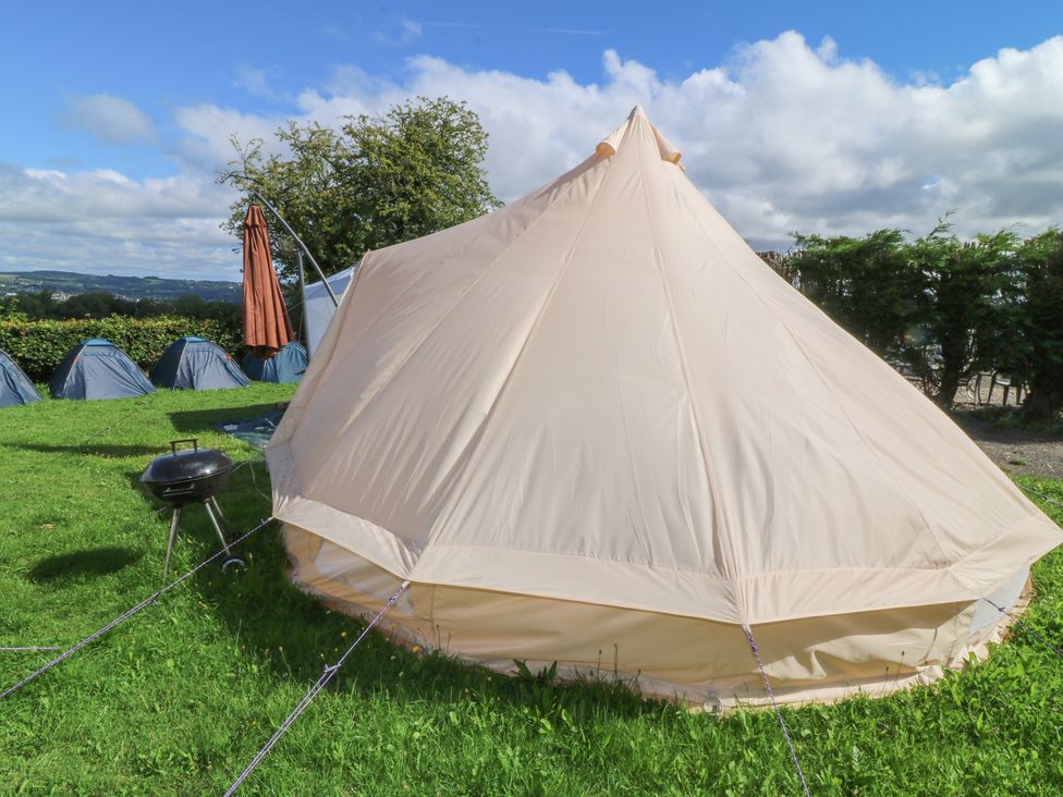 A bell tent with a grill in a camping area at Bell Tent One