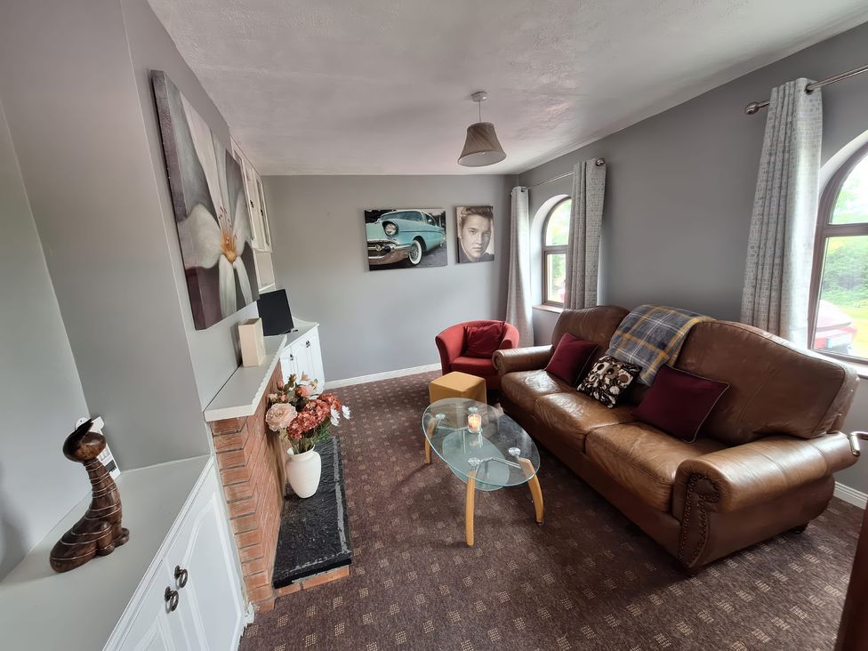 A living room with a sofa and coffee table at Lilly's Bungalow in Timoleague