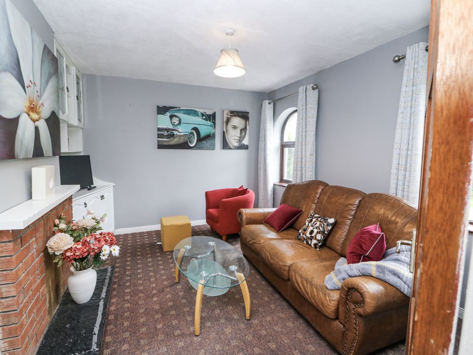 A living room with a sofa and coffee table at Lilly's Bungalow in Clonakilty, County Cork