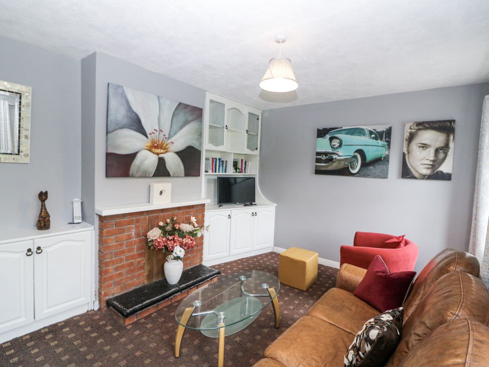 A living room with a sofa and a coffee table at Lilly's Bungalow in Clonakilty, County Cork