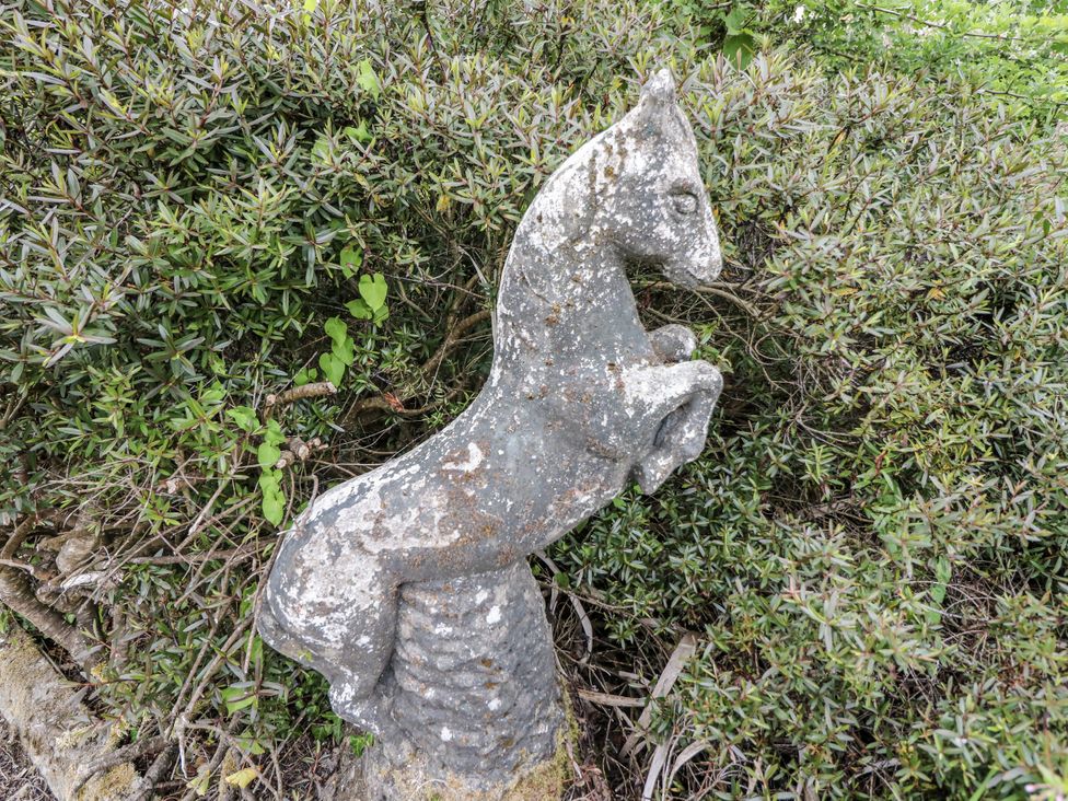 A horse statue next to greenery at Lilly's Bungalow, Clonakilty, County Cork