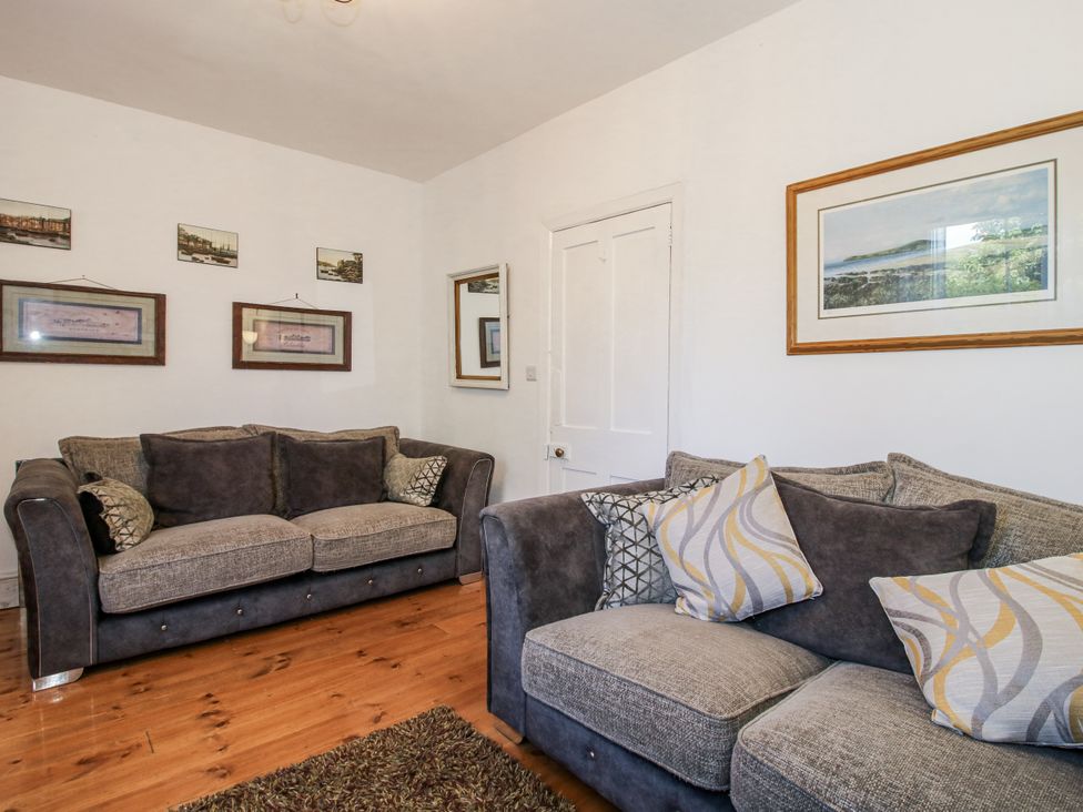 A living room with sofas and wall art at 157 Watling Street South, Church Stretton