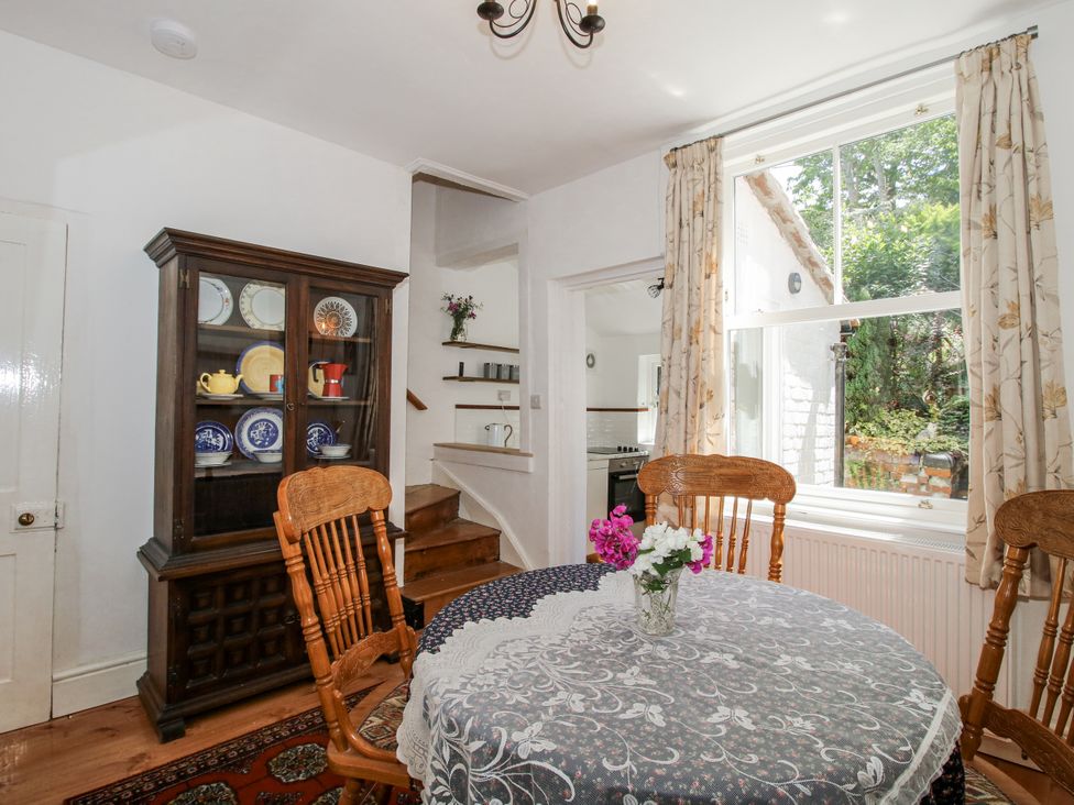 A dining room with a table and chairs at 157 Watling Street South, Church Stretton