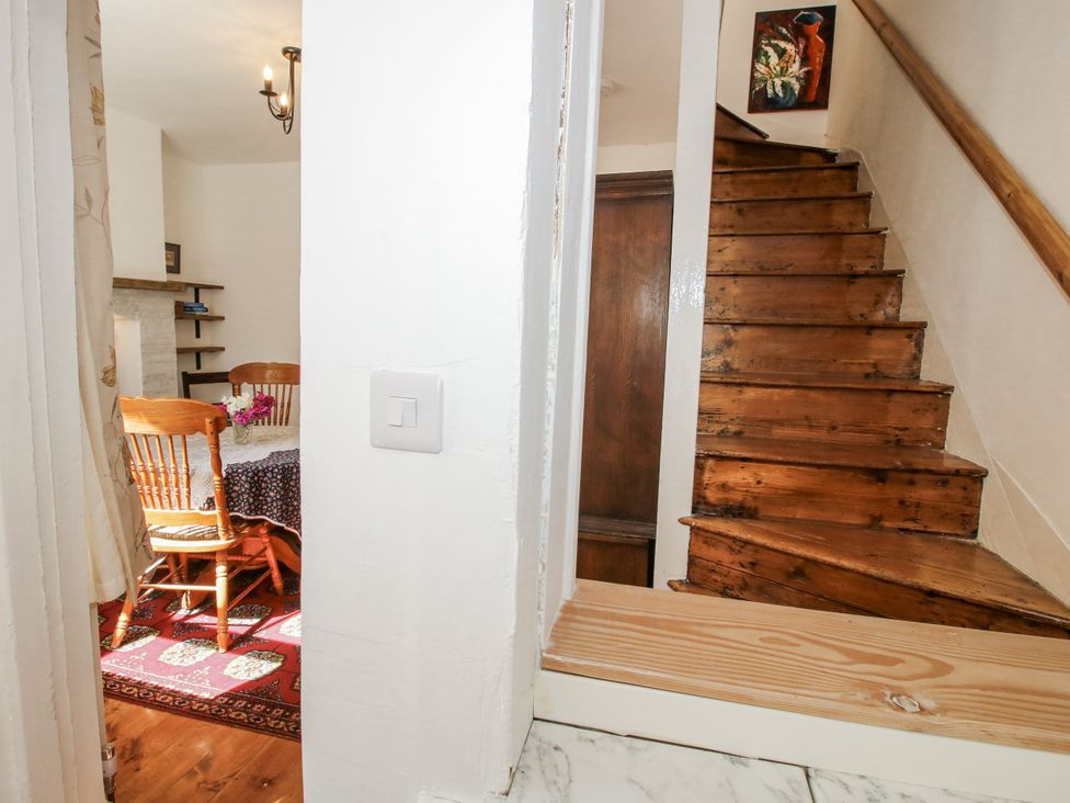 A dining room with a table and chairs at 157 Watling Street South Church Stretton