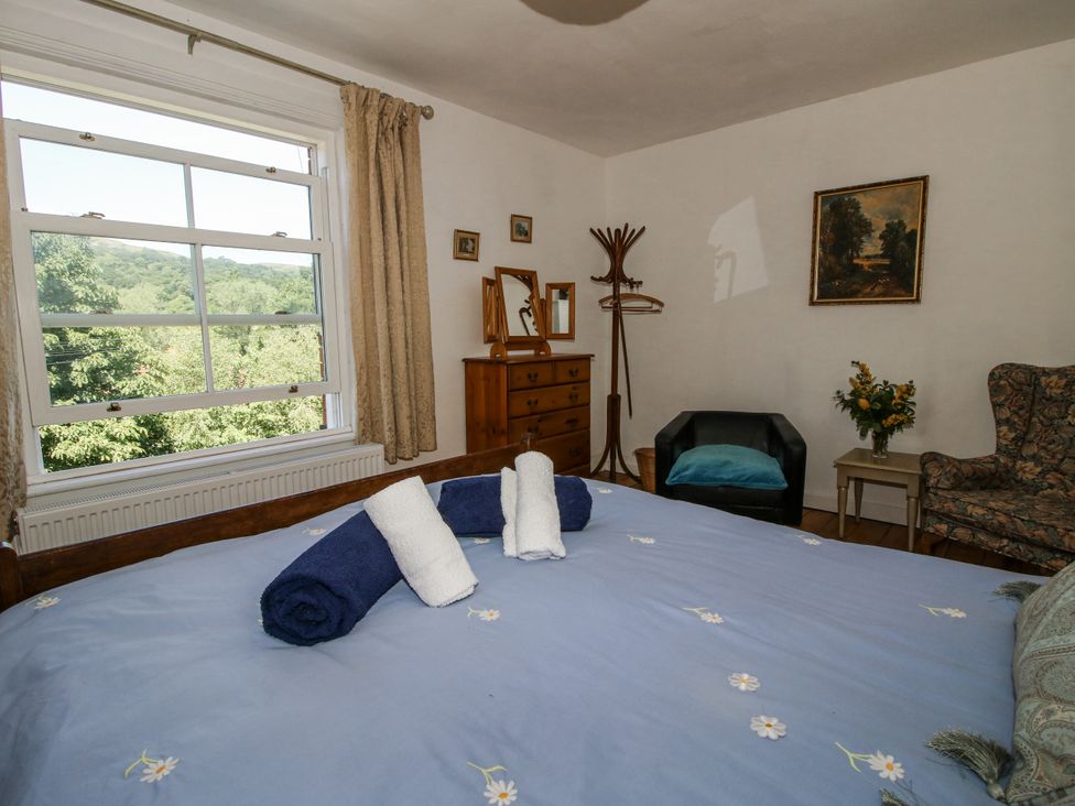 A bedroom with a bed and a dresser at 157 Watling Street South in Church Stretton