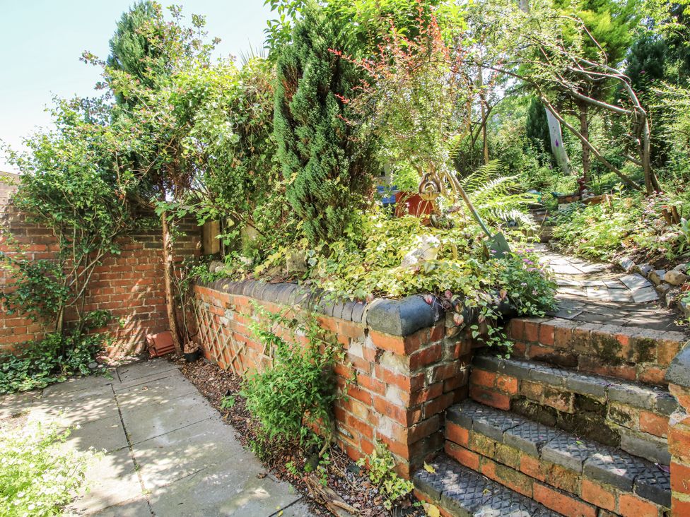 A garden with steps and plants at 157 Watling Street South in Church Stretton