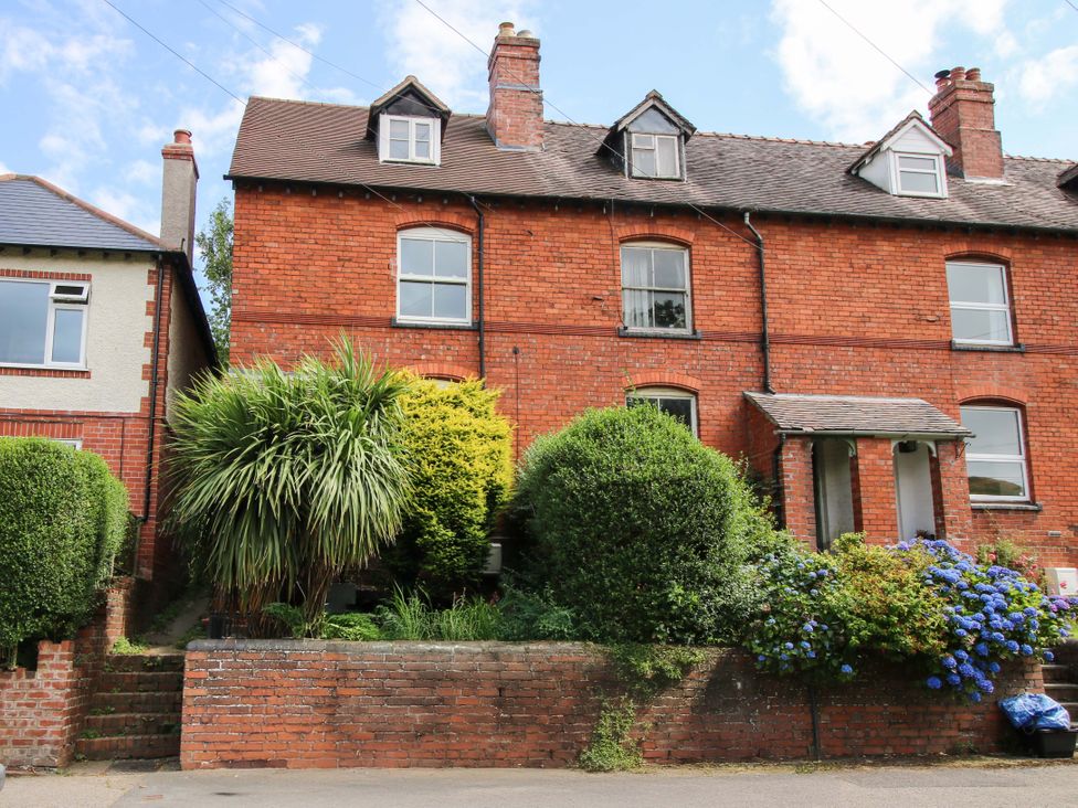 A brick house with a front yard at 157 Watling Street South, Church Stretton