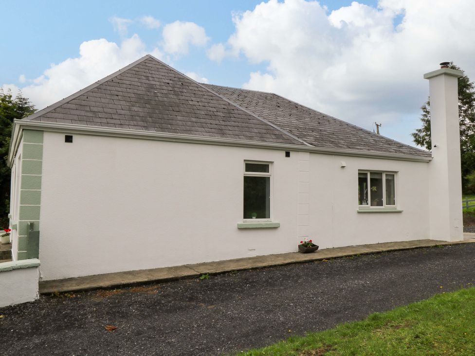 An exterior view of a house with windows and a chimney at CARROWREAGH
