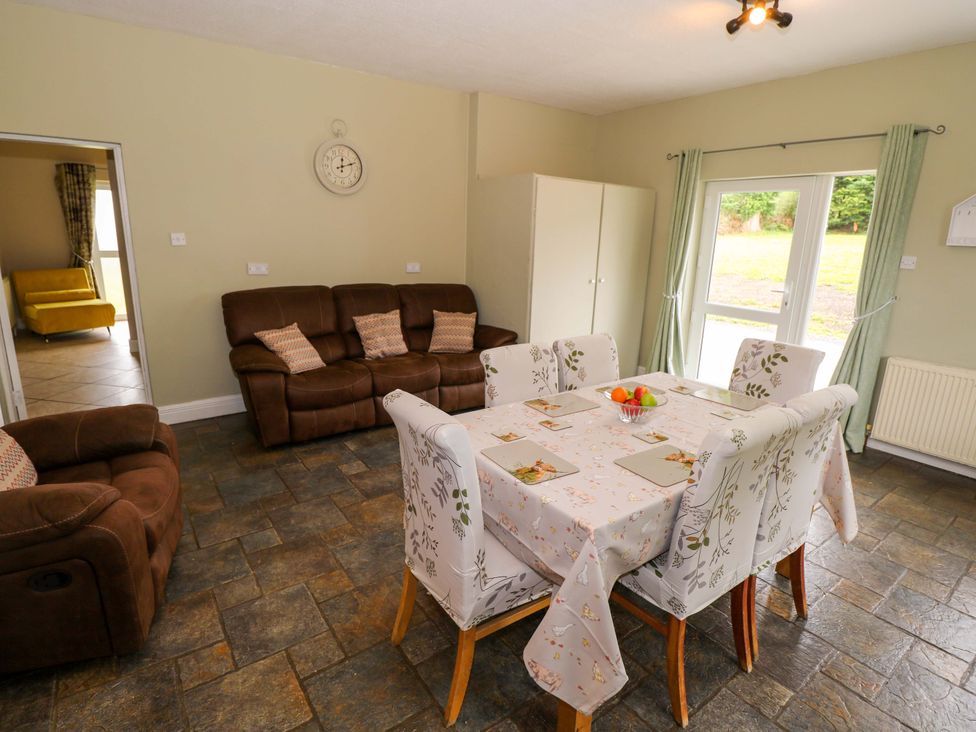 A dining room with a table and chairs at CARROWREAGH