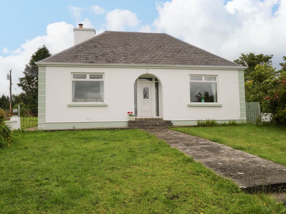 A house with a pathway and garden at CARROWREAGH