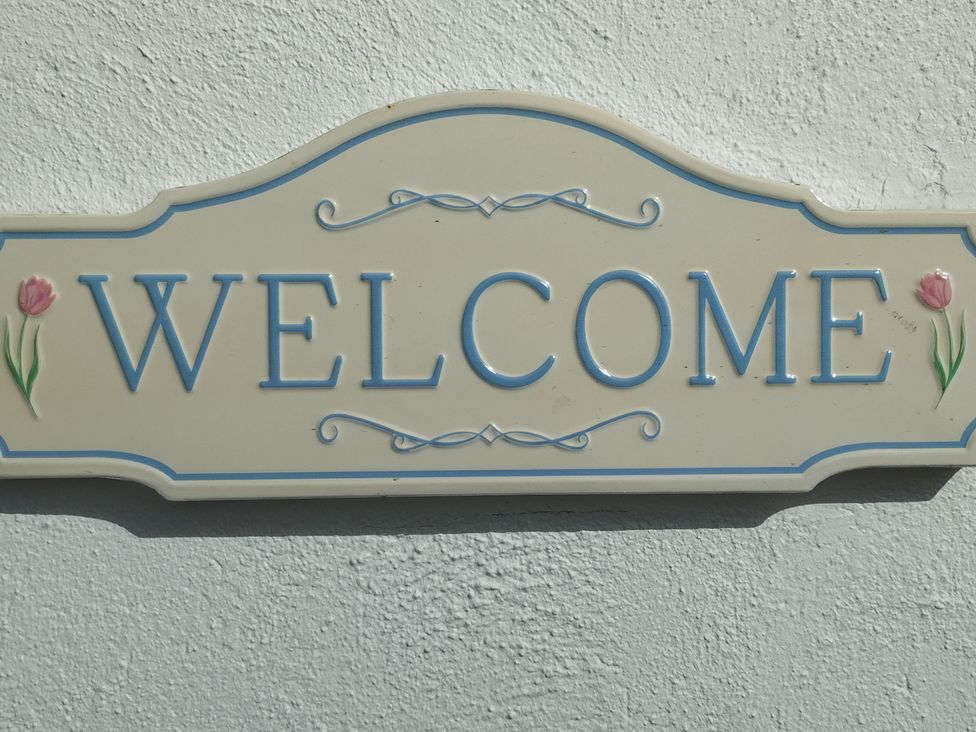 A welcome sign on a wall at Carrowreagh, Aclare, County Sligo
