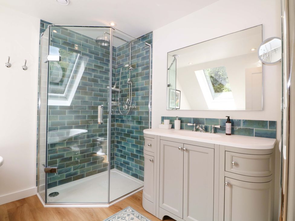 A bathroom with a shower and vanity at Lakeside Lodge near Witherenden Hill Burwash