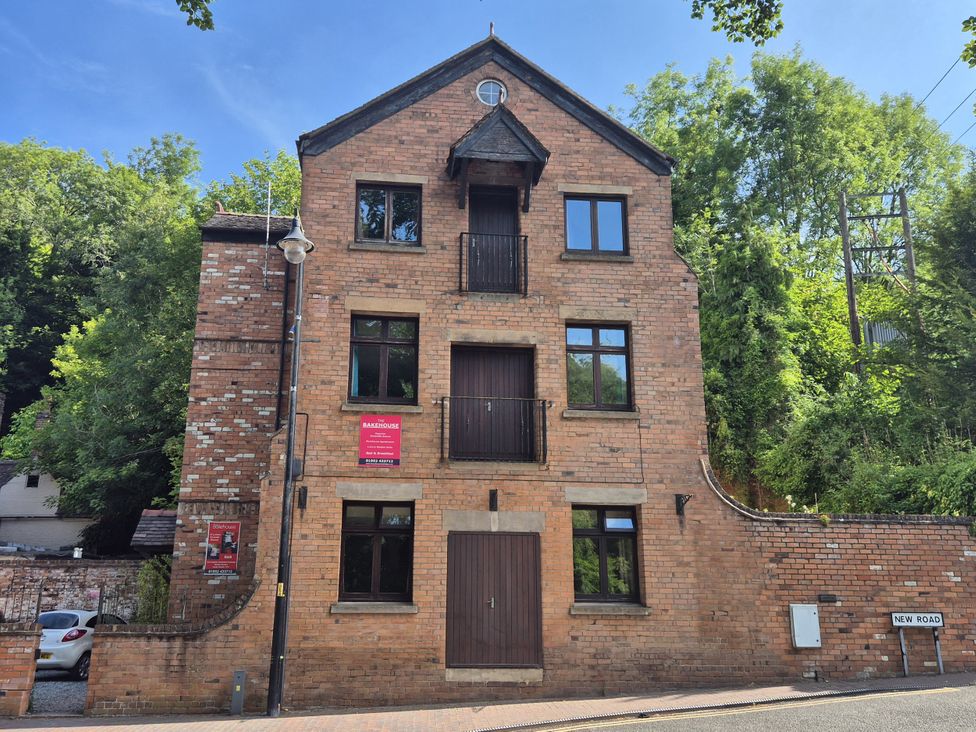 A brick building with windows and signage on New Road Telford
