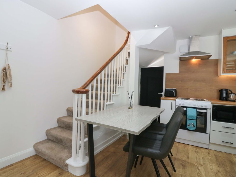 A kitchen with a table and chairs at 3 Caroline Place Fraserburgh