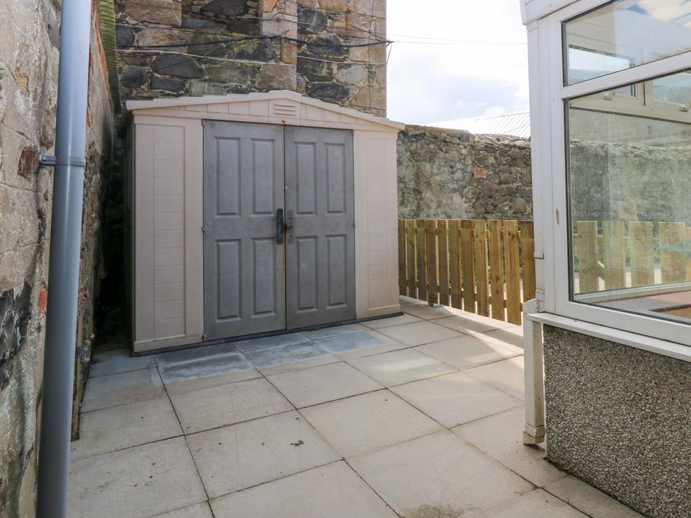 An outdoor area with a shed and patio at 3 Caroline Place Fraserburgh