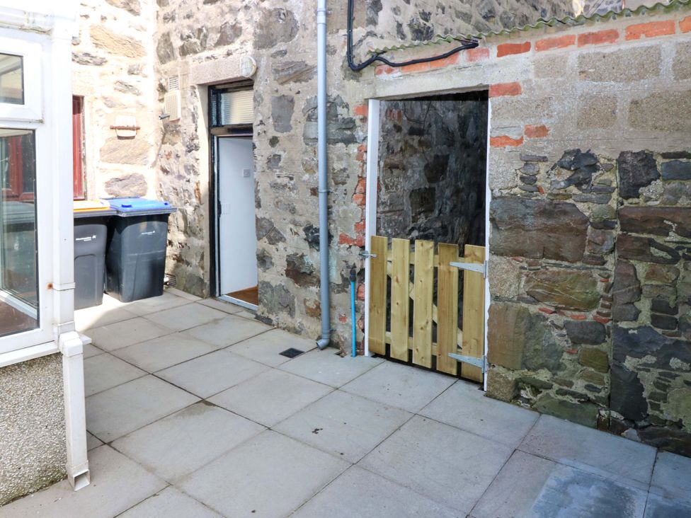 An outdoor area with rubbish bins and a wooden gate at 3 Caroline Place Fraserburgh