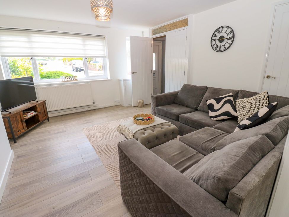 A living room with a sofa and television at 8 Shearwater Way Blyth