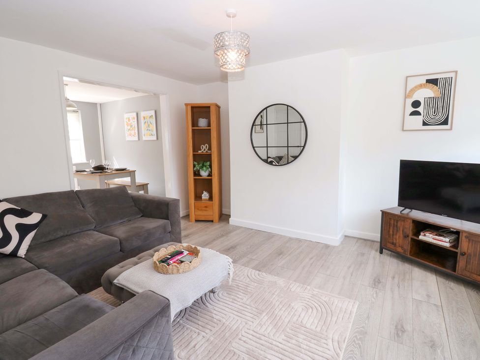 A living room with a sofa and tv at 8 Shearwater Way Blyth