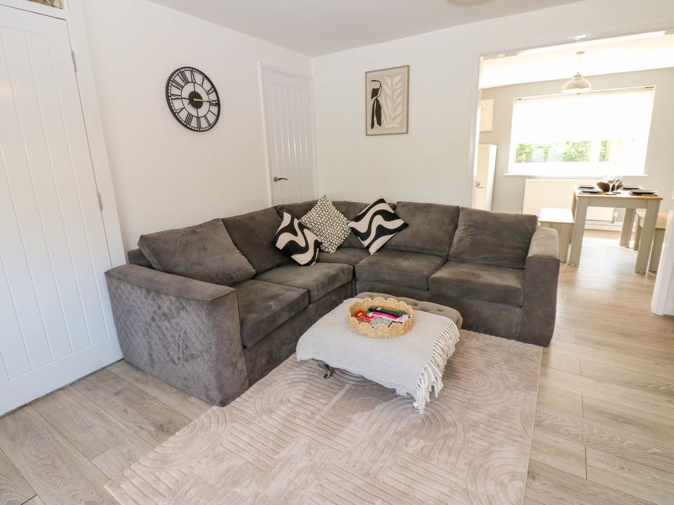 A living room with a sofa and coffee table at 8 Shearwater Way in Blyth