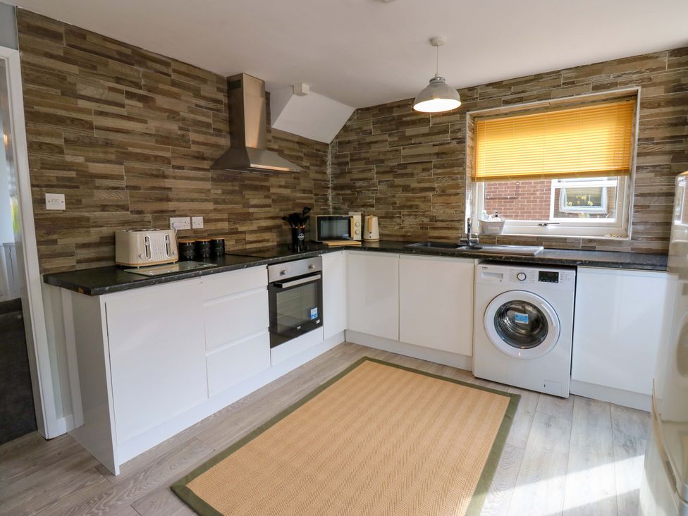 A kitchen with appliances and a countertop at 8 Shearwater Way Blyth
