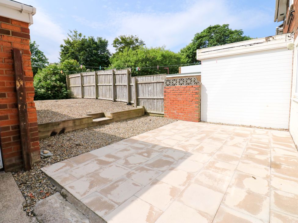 A garden with gravel and a patio at 8 Shearwater Way Blyth