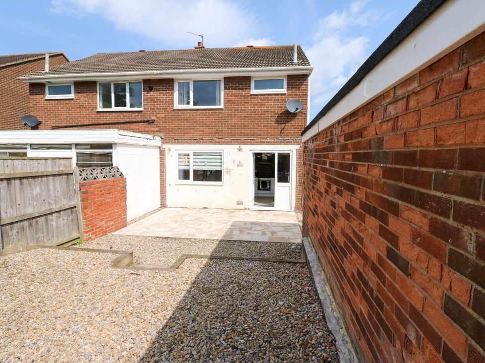 An outdoor area with a patio and gravel at 8 Shearwater Way Blyth