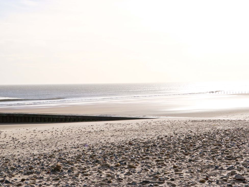 A beach with sand and rocks near the sea at 8 Shearwater Way Blyth
