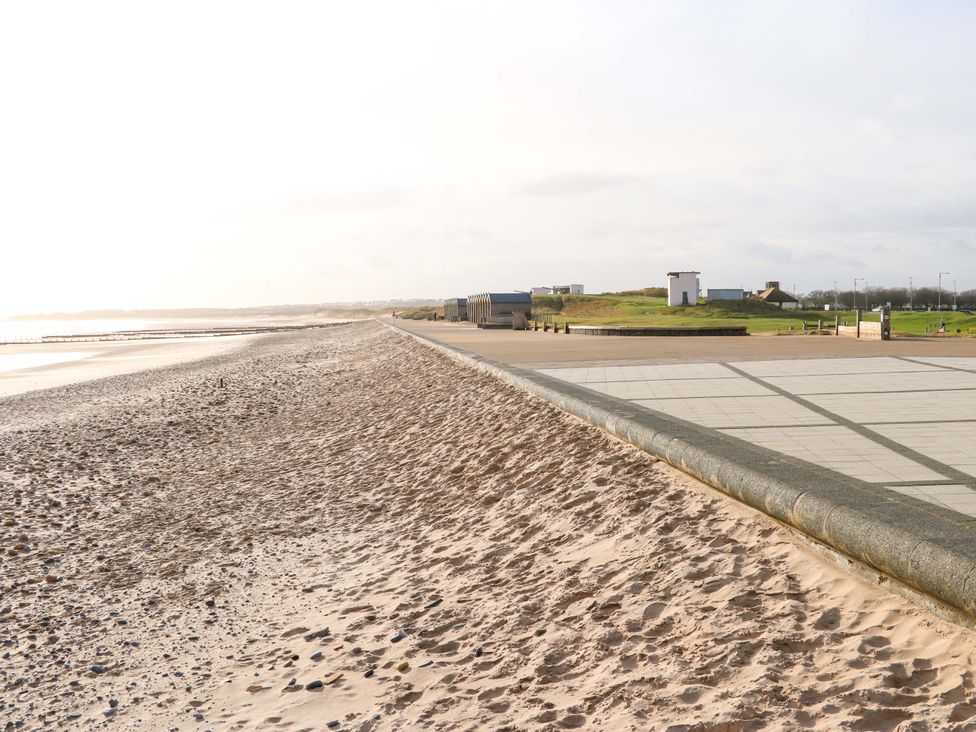 A beach with sand and a pathway at 8 Shearwater Way Blyth