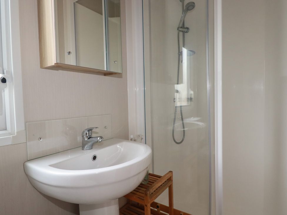 A bathroom with a sink and shower at The Maples, no. 56 Hewas Water near Polgooth