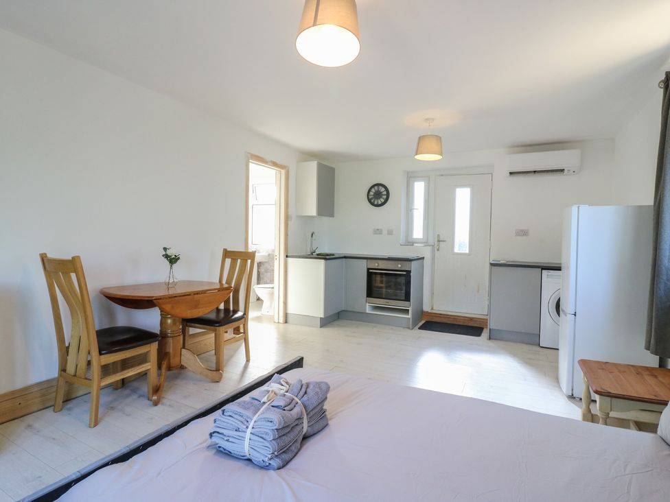 A kitchen with a table and chairs at Sunflower Northampton
