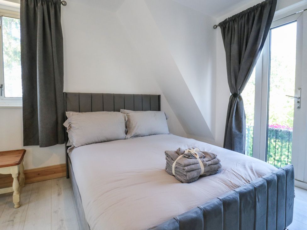 A bedroom with a bed and a window at Sunflower in Northampton