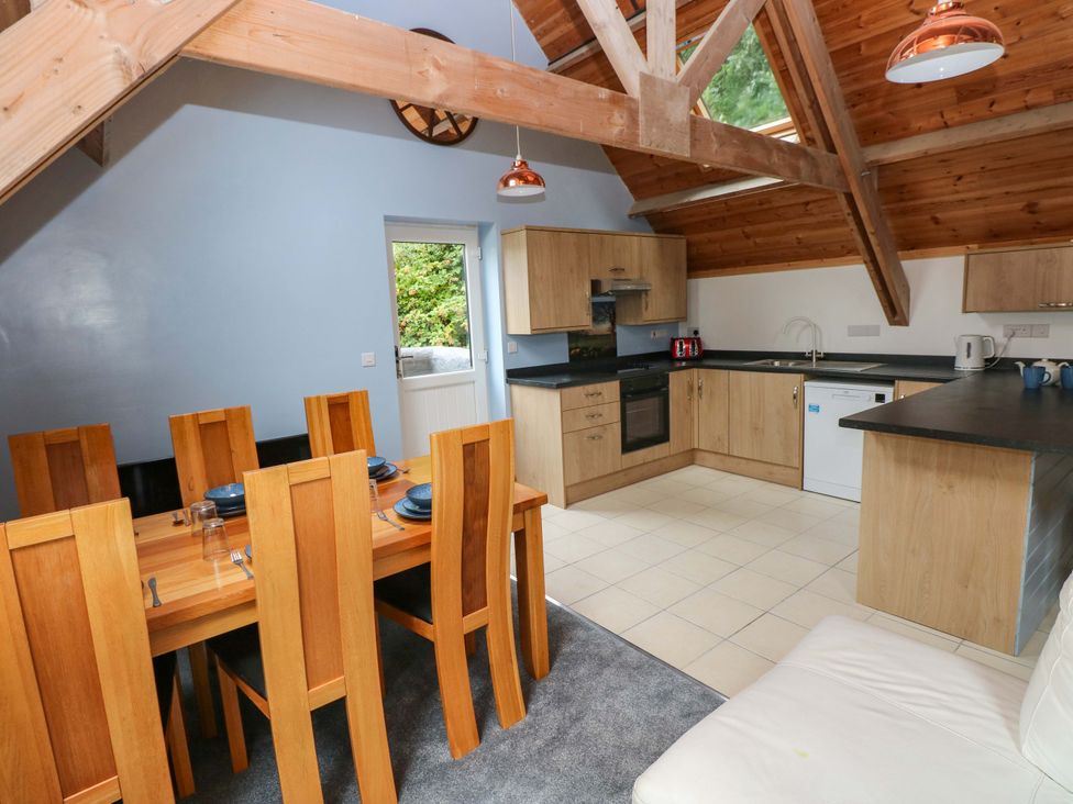A kitchen with a dining area at Pendre Barn in Llanfyrnach
