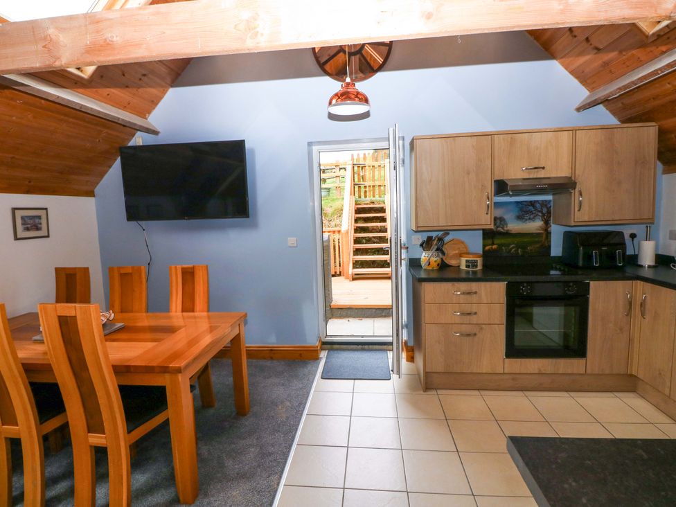 A kitchen with dining area at Pendre Barn Star near Cenarth