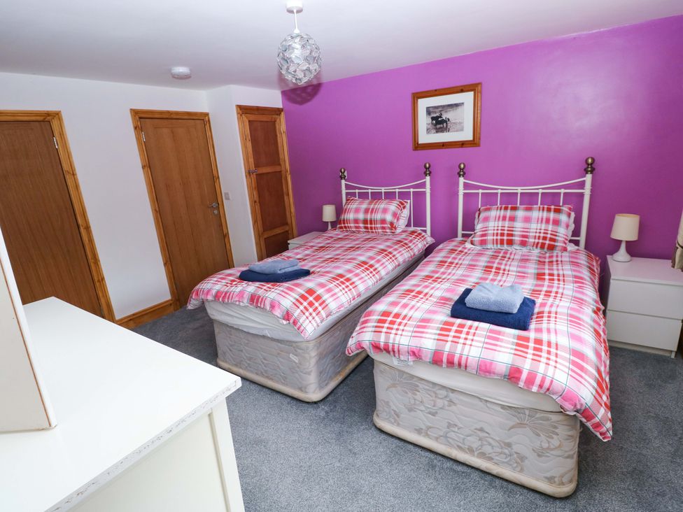 A bedroom with two single beds at Pendre Barn Star near Cenarth