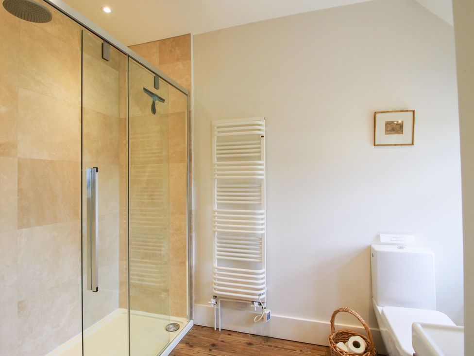 A bathroom with a shower and a toilet at Uplands House Ledbury
