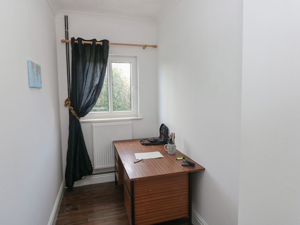 An office with a desk and chair at Maes Hyfryd in Clynderwen